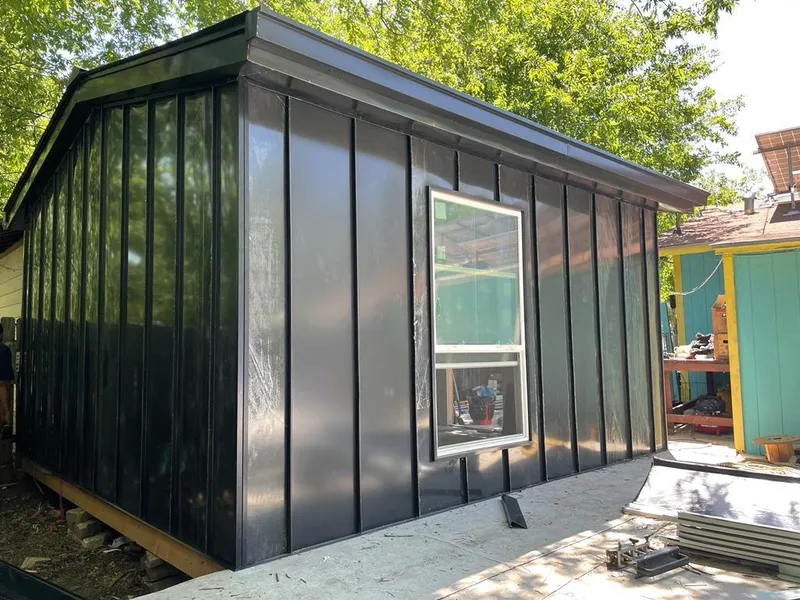 Black standing seam metal wall panels for Metal Roof Installation in Dedham