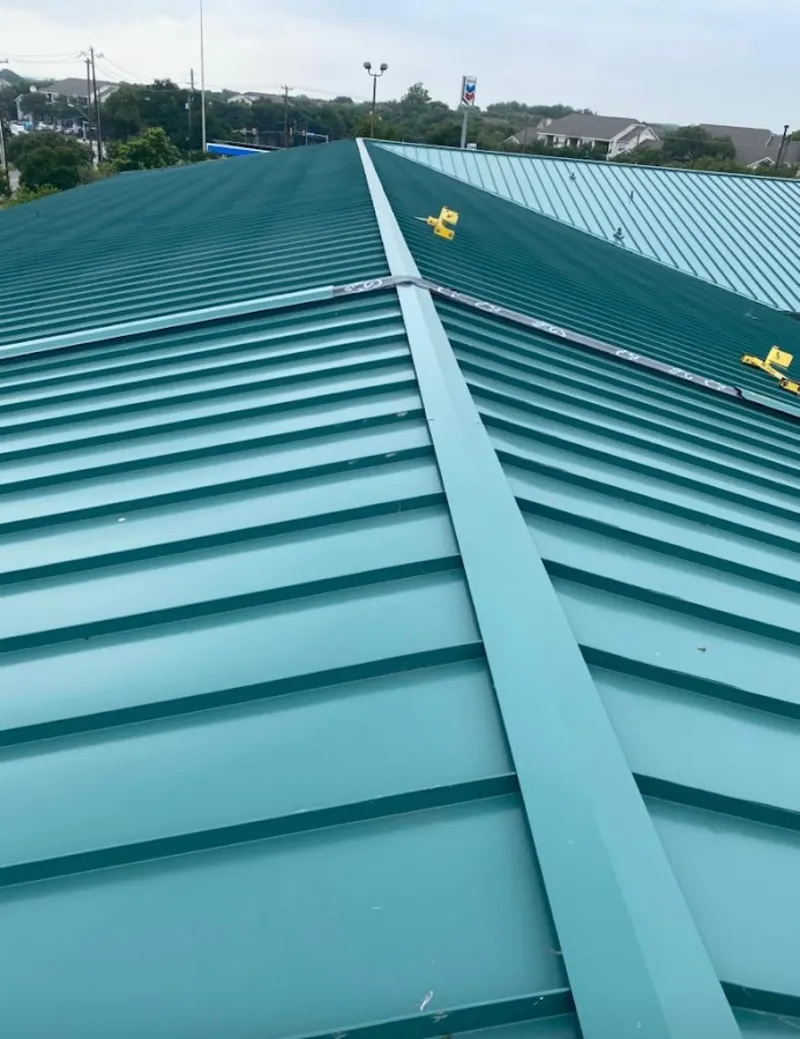 Green commercial metal roof ridge and valley for Metal Roof Repair in Dedham