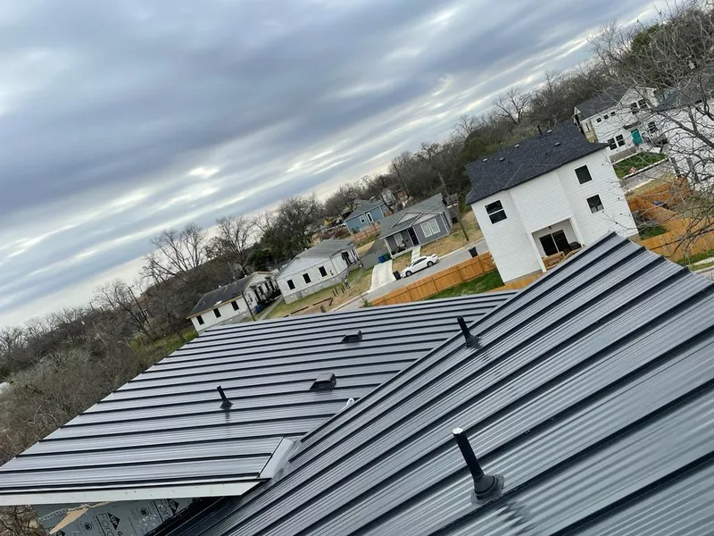 Standing seam metal roof panels with vents for Skylight Repair in Dedham